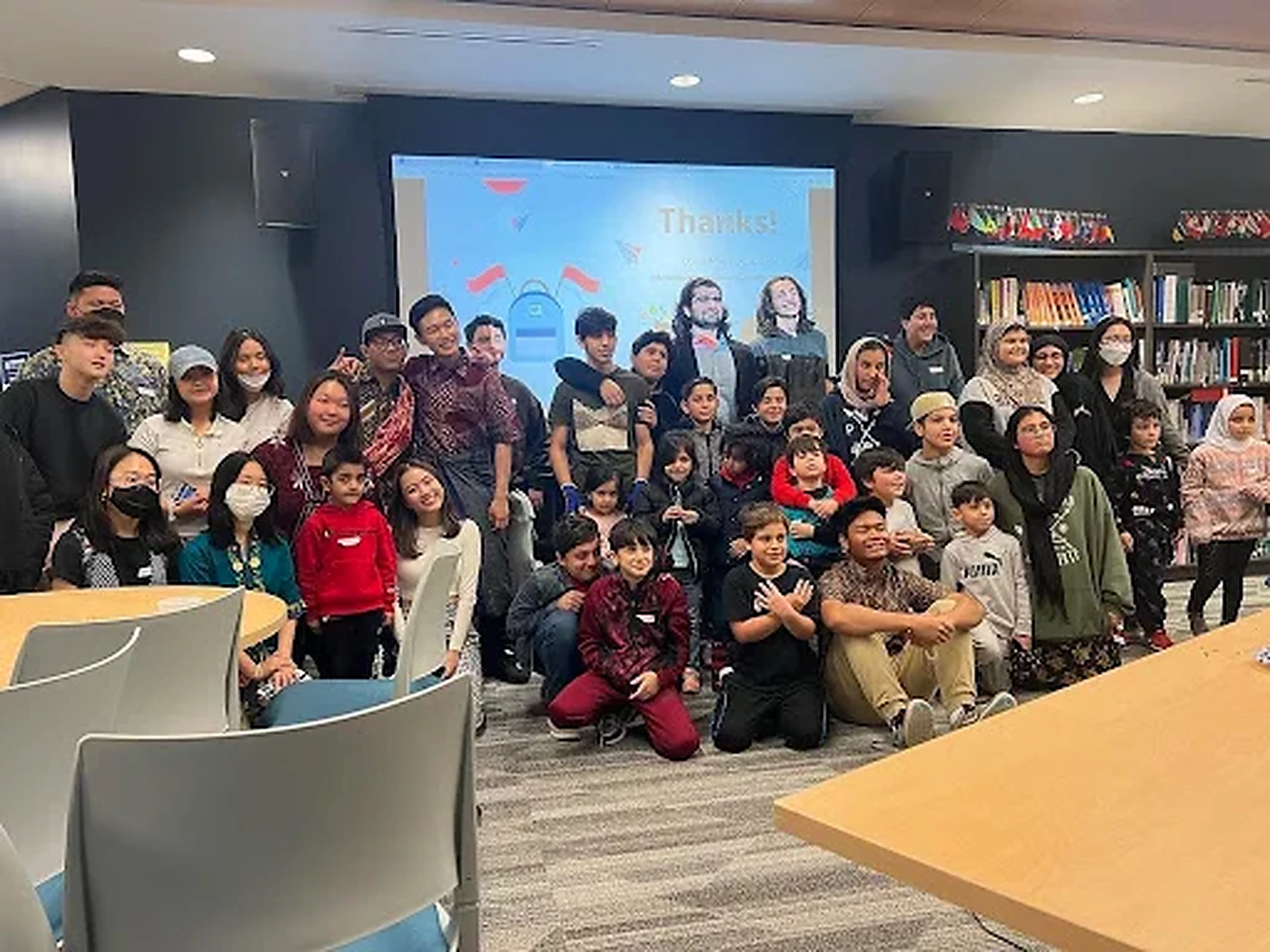 Students, families, and volunteers gathered at the close of a House of Wisdom session